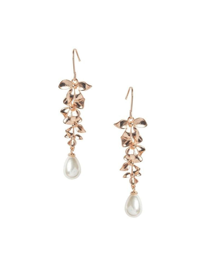 Dangling earring with orchid petals in gold and a teardrop pearl hanging from the bottom