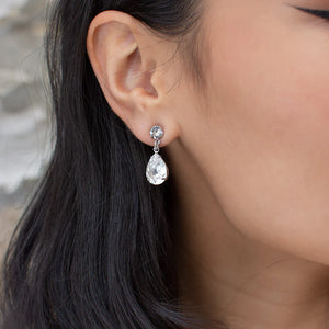 Rosemary earrings of round cubic zirconia stud with teardrop shaped diamante hanging from it. 