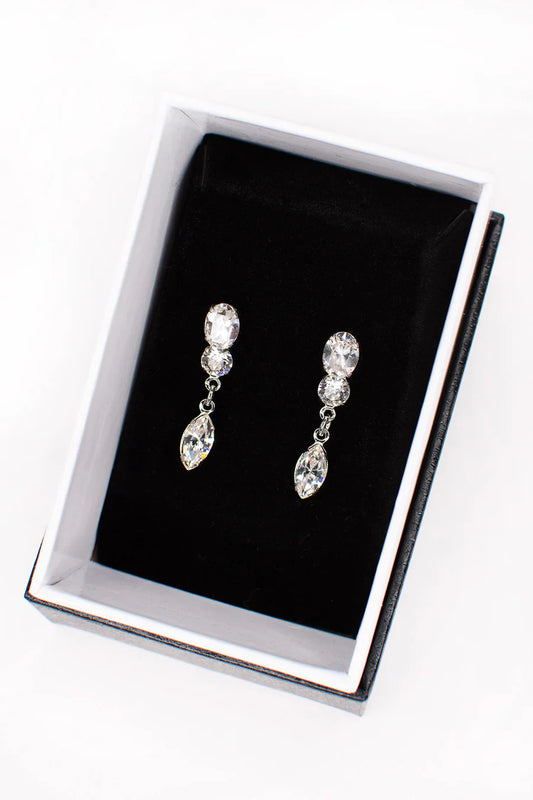 Double cubic zirconia stud earrings with a dangling marquise cut gem