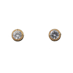 Round cubic zirconia in a border of smaller cubic zirconia set in gold