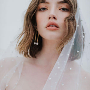 Close up of Oli Veil in silky tulle, dotted with pearl beads.