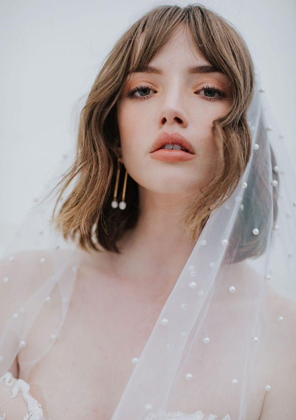 Close up of Oli Veil in silky tulle, dotted with pearl beads.
