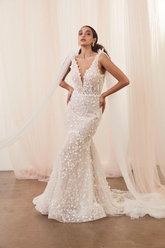 Mermaid cut, plunging v-neck Saige gown with 3D floral vines. Attached are long tulle wings.