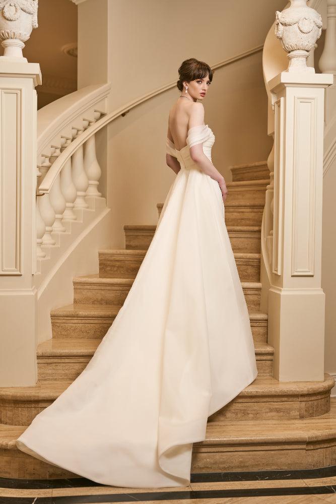 Back view of Tamsin gown with Tamsin Overskirt. Overskirt is a voluminous a-line shape made from Organza with satin lining giving it structure. 