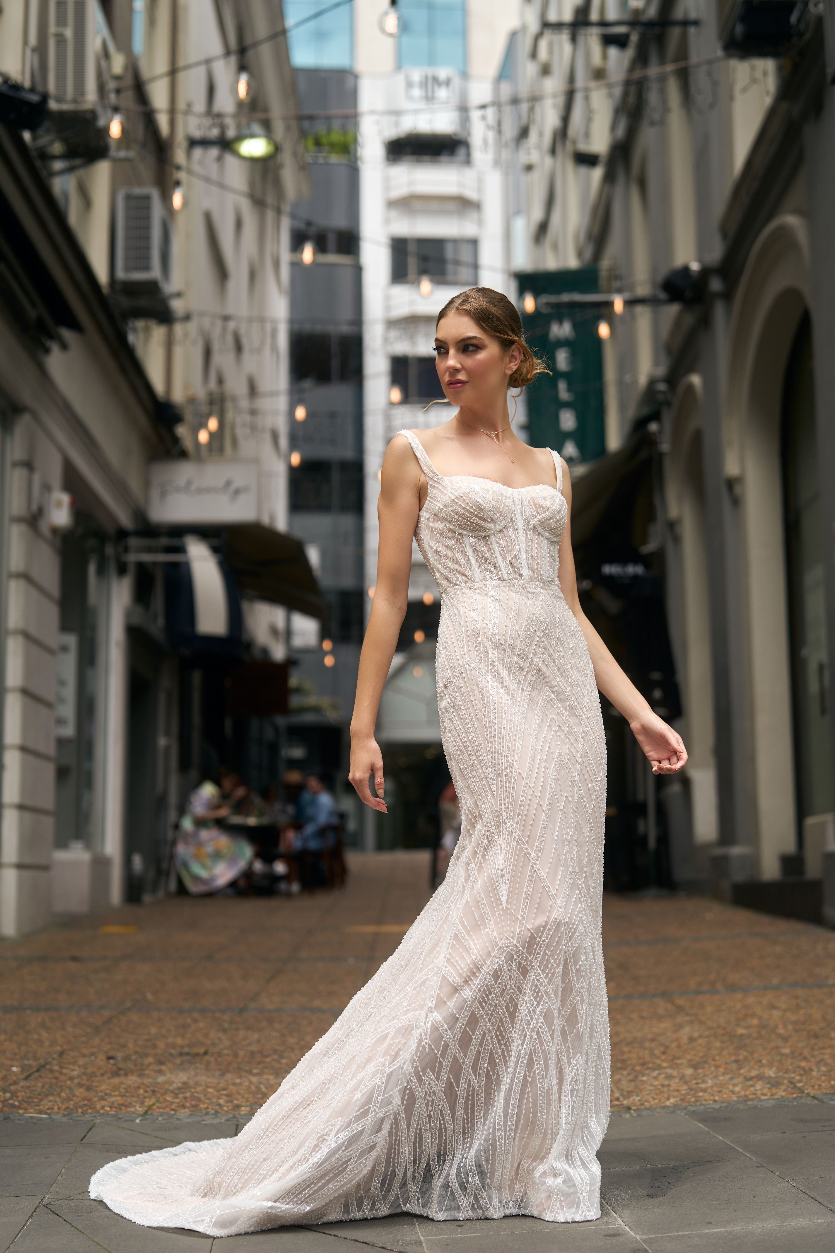Fashioned with beaded lace, this fit-n-flare gown features a square neckline and fully boned bodice and beaded straps.. 