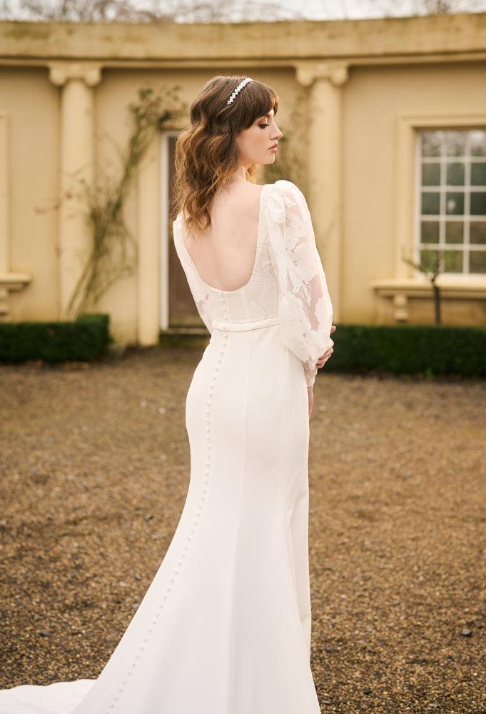 Tamia gown back view. Scoop back with covered buttons that run the length of the train.