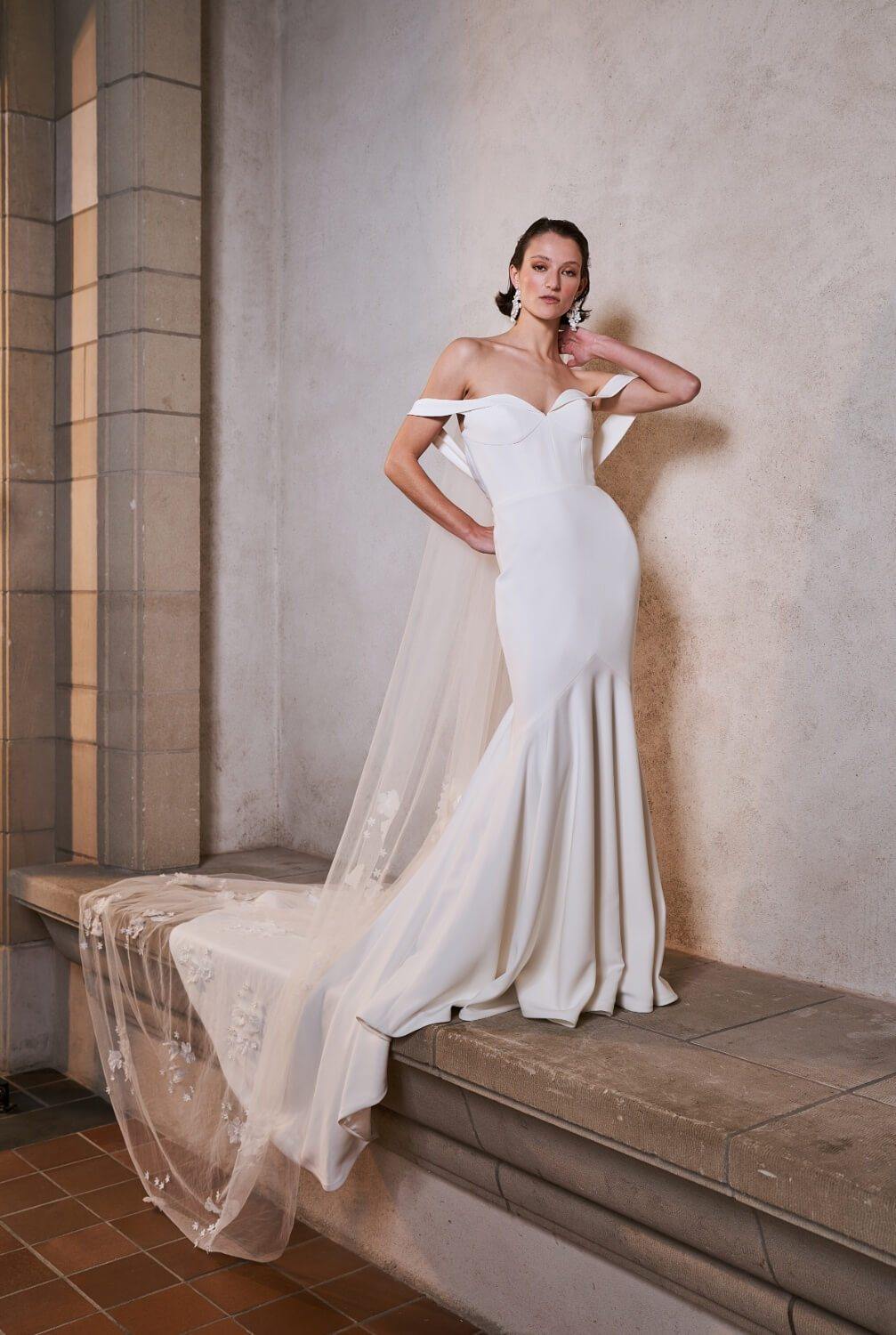 Model wearing figure hugging Sienna wedding dress from the Royal collection