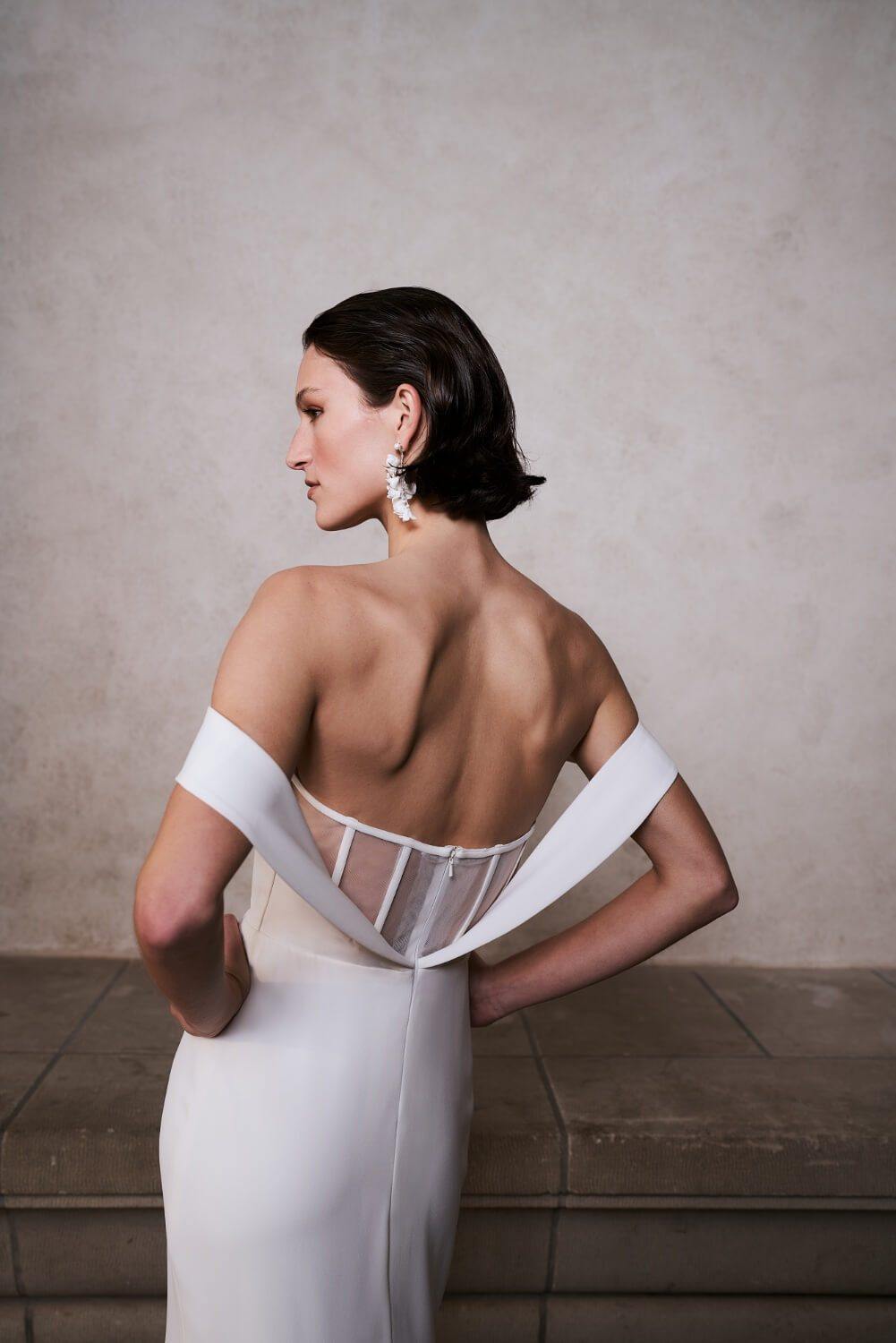 Model wearing figure hugging Sienna wedding dress from the Royal collection