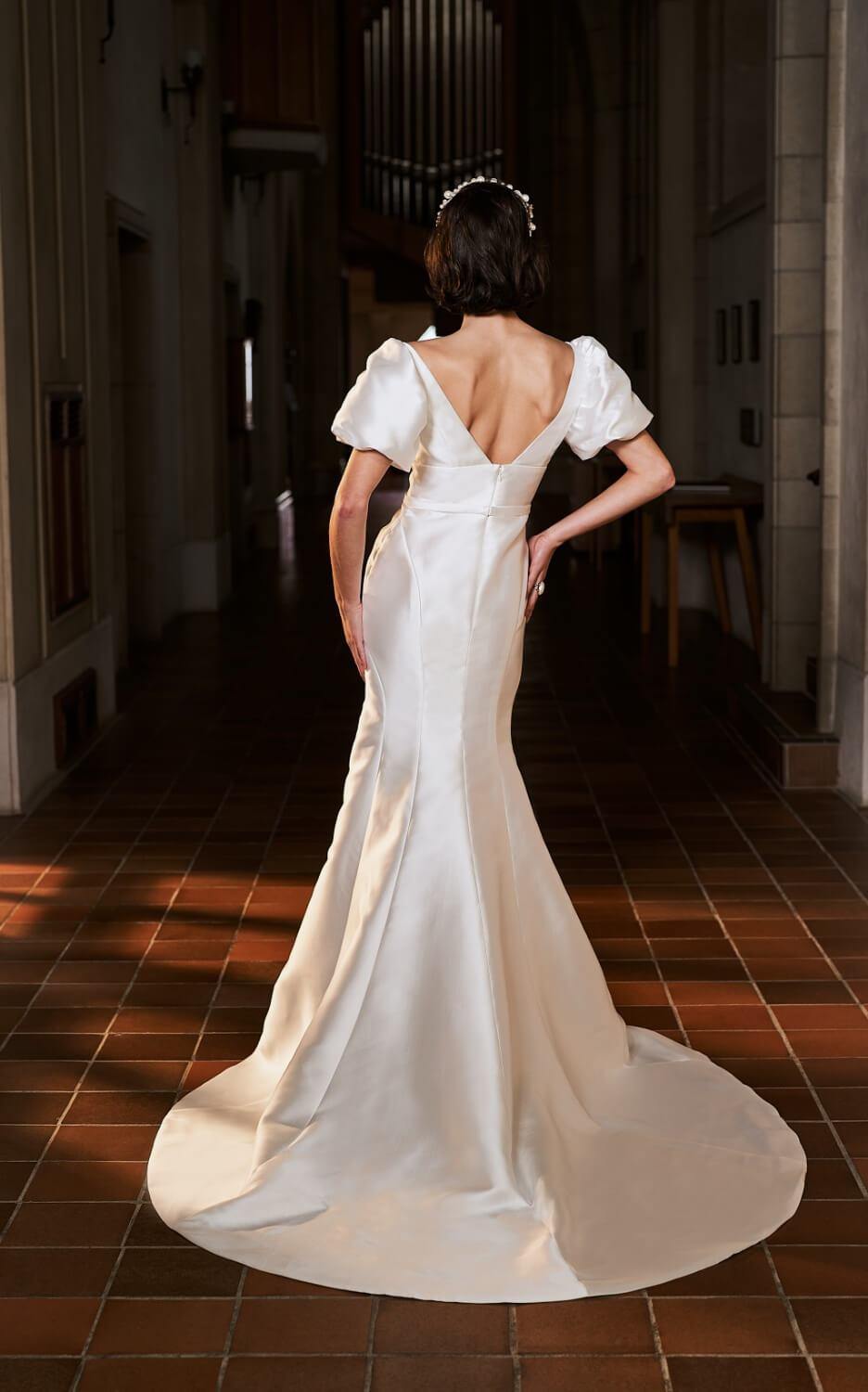 Model wearing Sydney wedding dress with statement sleeves from the Royal collection