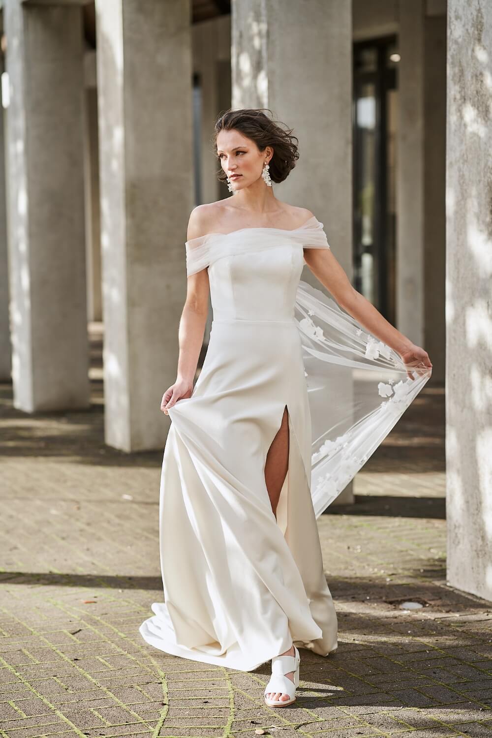 Model wearing Sabrina with tulle off-shoulder sleeves from the Royal collection