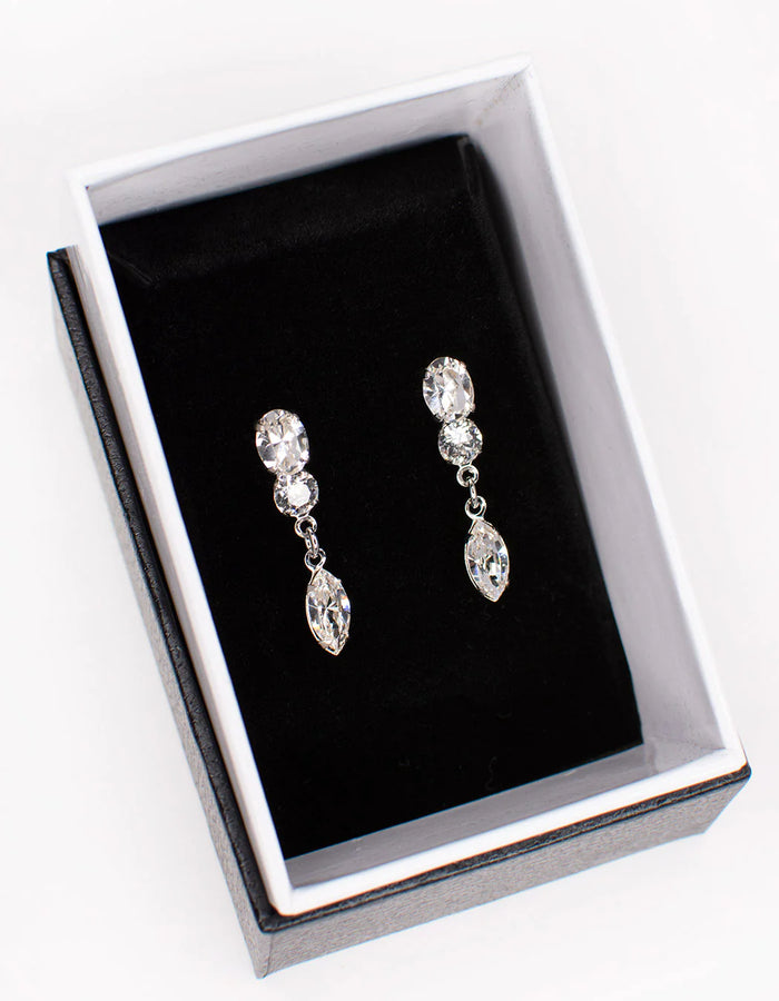 Double cubic zirconia stud earrings with a dangling marquise cut gem