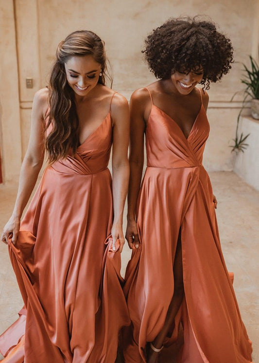 Suva bridesmaid gown in burnt orange colour. Cross over V-neck with pleated detail and front split