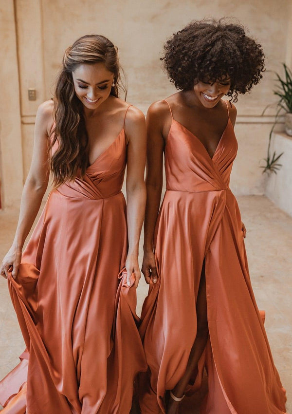 Suva bridesmaid gown in burnt orange colour. Cross over V-neck with pleated detail and front split