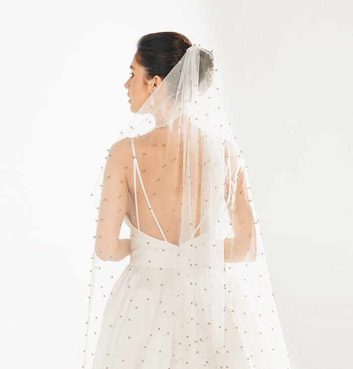 back view of orfia veil, studded in silver balls