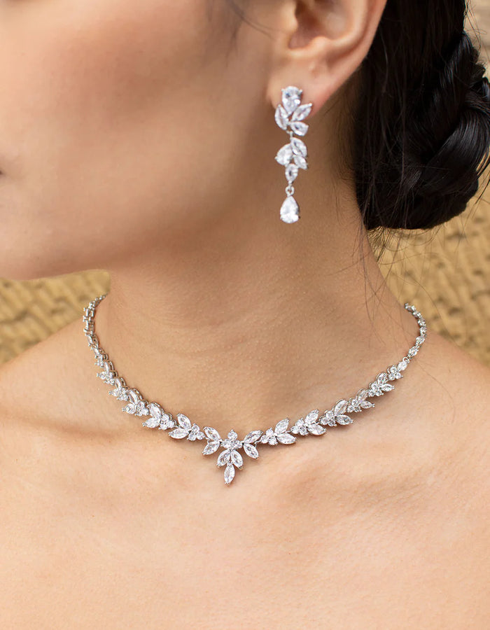 Short length diamante necklace on silver backing in organic navette shape.
