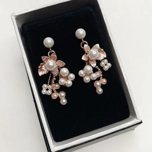 Rose Gold pearl encrusted flower earrings in matte finish metal.